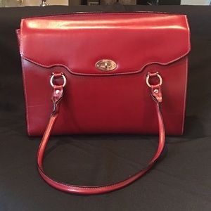 Large red executive bag - can carry a 15” laptop.